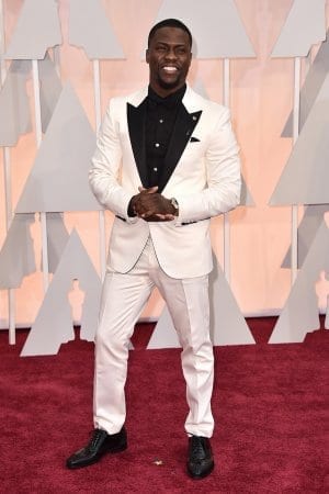 Kevin Hart in white suit and black shirt posing for camera - short actors