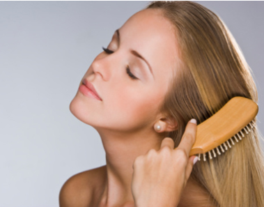 Does Hair Dye Cause Hair Loss or Damage Your Hair? 1 Girl is brushing her hair - thin hair
