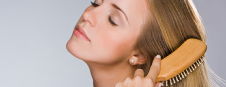 Girl is brushing her hair - thin hair