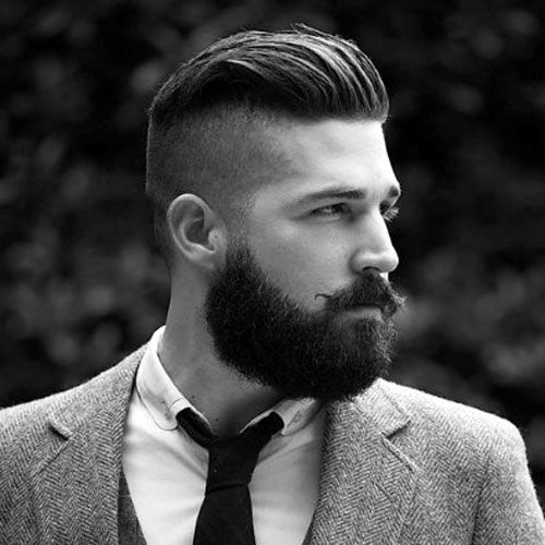 A man in grey suit showing his Slick Back Undercut with Long Beard - Short Hairstyle for Men