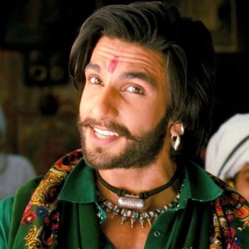 Smiling Ranveer Singh in a colorful outfit - Ranveer Singh Haircut 