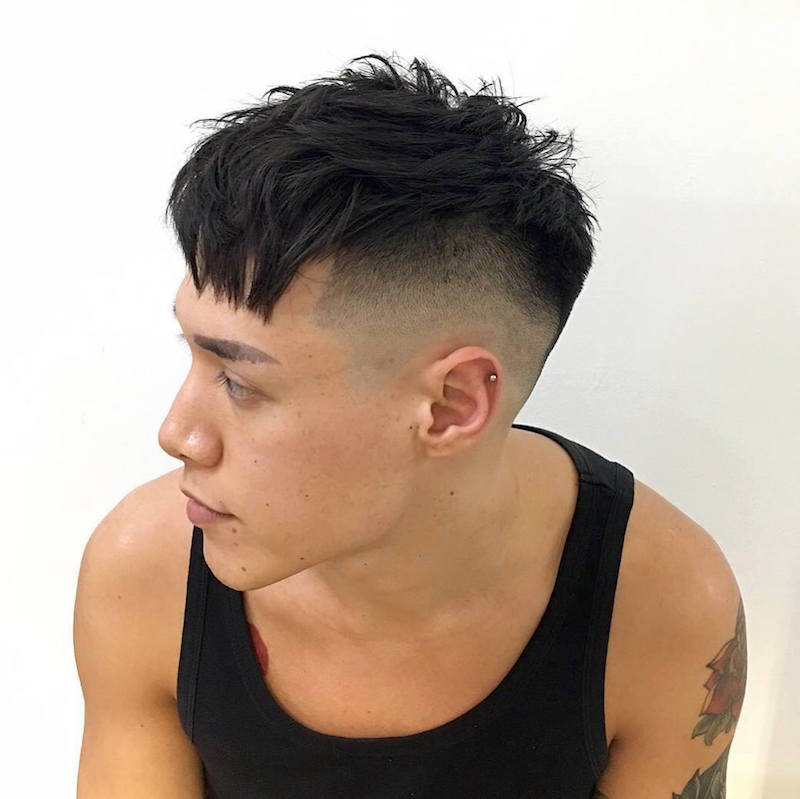 A man in black vest showing the side view of his Messy Crop Haircut - Latest Hair Cut for Men and Boys