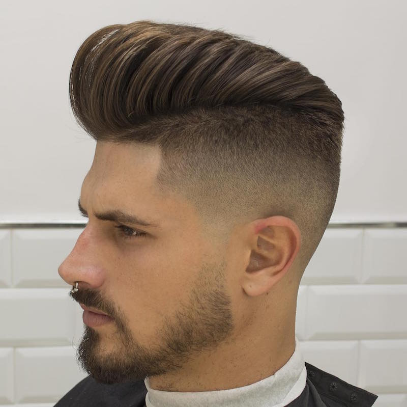 A man with nose pin showing the side view of his Medium Length Pampadour Hair style - Latest Hair Cut for Men and Boys