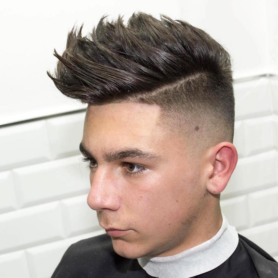A boy showing the side view of his Mid-Fade Textured Pomp - hair cuts for men and boys