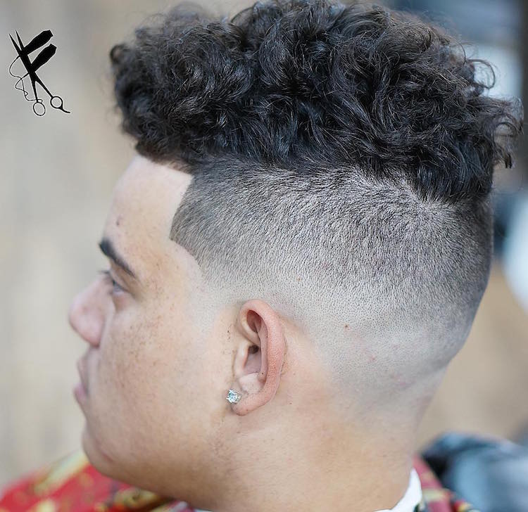 A man in diamond stud showing the side view of his Curly Undercut - Latest Hair Cut for Men and Boys
