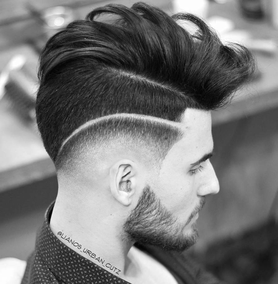A man in printed shirt showing the side view of his Undercut with Surgical line - Latest Hair Cut for Men and Boys