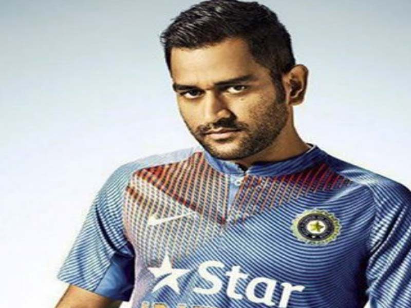MS Dhoni in indian cricket uniform posing for camera - MS Dhoni haircut