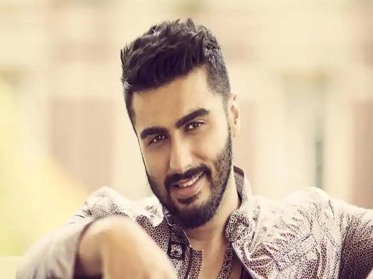 Arjun Kapoor in patterned shirt posing for the camera - Hairstyle of Bollywood actors