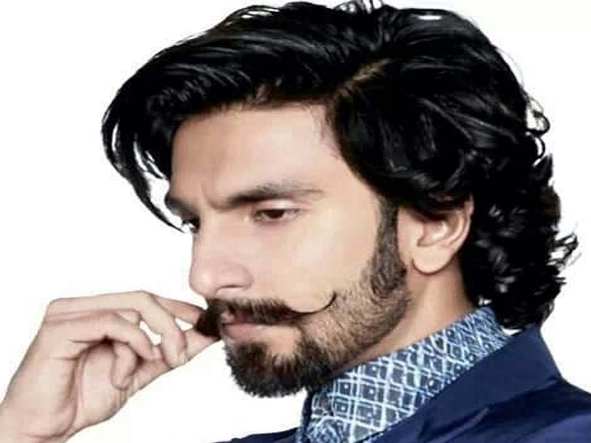 Ranveer Singh posing for camera 
 in bluecoat with blue and white printed 
 shirt - Bollywood actors' hairstyle