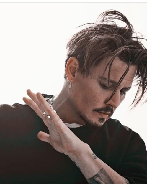 Johnny Depp in black t-shirt posing for camera - Johnny Depp Hairstyles