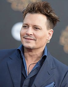 Smiling Johnny Depp in blue suit with matching shirt posing for camera - Johnny Depp Short Hairstyles