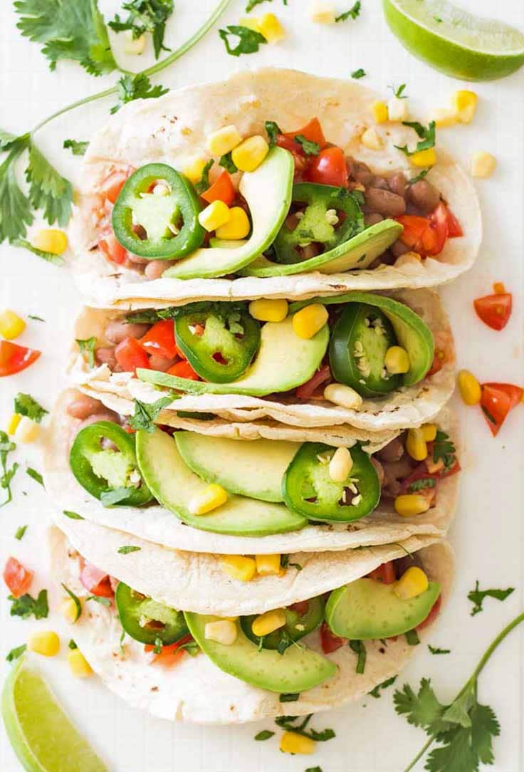 Plate of vegan pinto bean tacos - vegetarian breakfast ideas for bodybuilding 