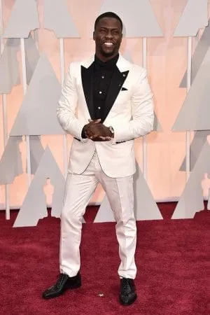Kevin Hart in white suit and black shirt posing for camera Kevin Hart in white suit and black shirt posing for camera - short actors