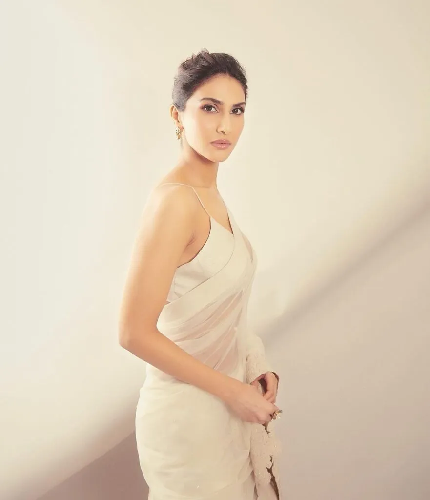 Vaani Kapoor in light pink saree with strappy blouse and bun hairstyle Vaani Kapoor in light pink saree with strappy blouse and bun hairstyle - bollywood actresses haircut