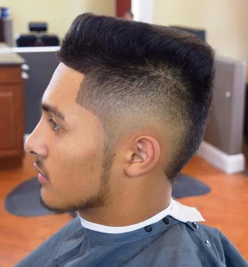 Man in blue outfit and Slanting Top Cut hairstyle - haircuts for men