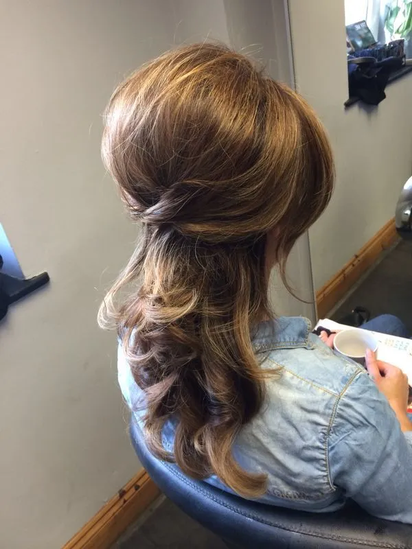 A girl in denim shirt showing the back side of her Blow-Dried Curls A girl in denim shirt showing the back side of her Blow-Dried Curls - hairstyles for wedding