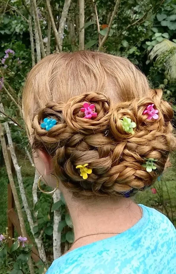 A girl in greenish t-shirt showing the back view of her Bouquet Bun A girl in greenish t-shirt showing the back view of her Bouquet Bun - wedding hairstyles