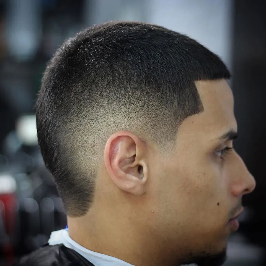 A man is showing the side view of his Burst Fade Hairstyle A man is showing the side view of his Burst Fade Hairstyle - hairstyles for Men 2022