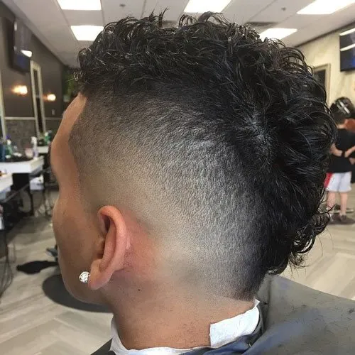 a boy is showing Burst Fade hairstyle a boy is showing Burst Fade hairstyle - Hairstyles For Boys