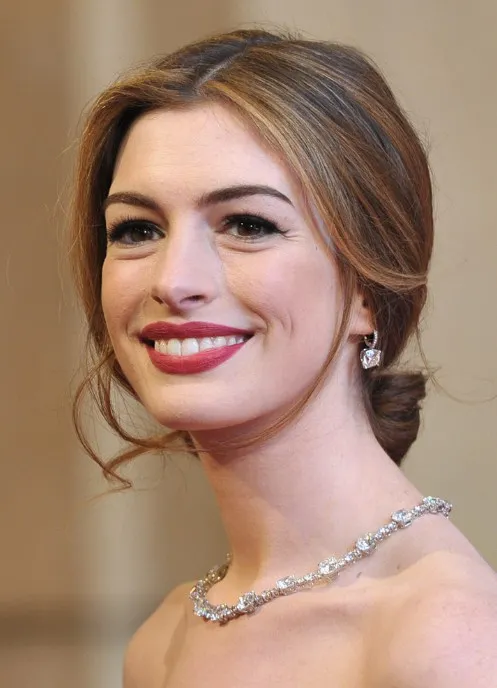 A woman in off shoulder dress with a necklace and earrings showing her Center Parted Updo A woman in off shoulder dress with a necklace and earrings showing her Center Parted Updo - hairstyles for women