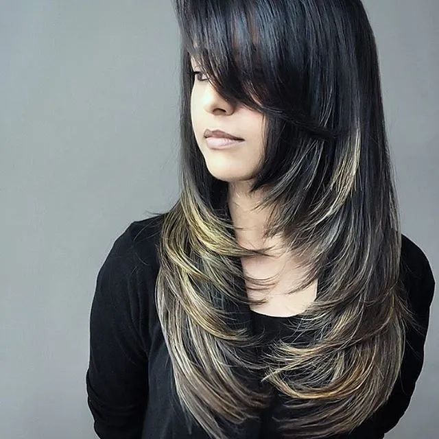 Woman in black top with Framing Layer hairstyle Woman in black top with Framing Layer hairstyle - Hair Cut Long Hairstyles