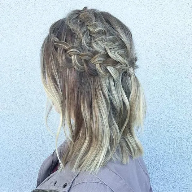 A woman in light blue denim jacket and Half Dutch Braid hairstyle A woman in light blue denim jacket and Half Dutch Braid hairstyle - hairstyles for girls with medium hair