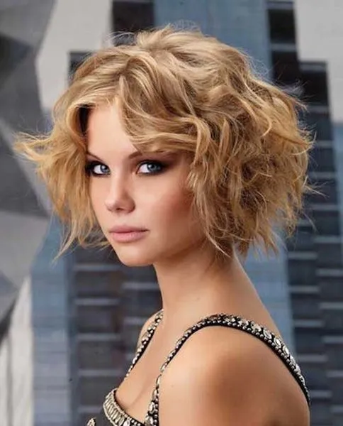 A woman in black and silver embroidery dress and Highlighted Curls hairstyles A woman in black and silver embroidery dress and Highlighted Curls hairstyles - haircuts for girls with medium hair