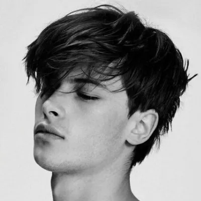 A boy is showing his Long Fringe A boy is showing his Long Fringe - Hairstyles for Boys