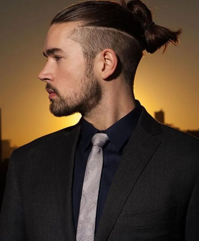 A man in black suit with grey tie showing his Long Undercut Hairstyle A man in black suit with grey tie showing his Long Undercut Hairstyle - hairstyle for Men 2018
