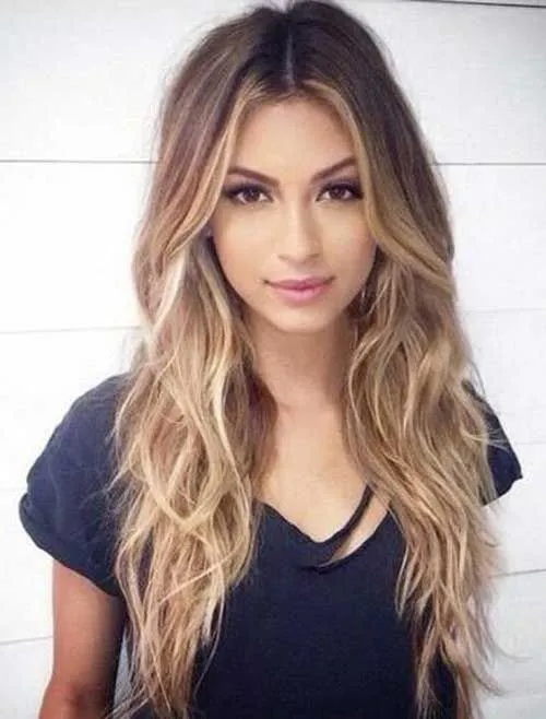 Woman in blue t-shirt with Long Wavy Style Woman in blue t-shirt with Long Wavy Style - Long Hairstyles for women