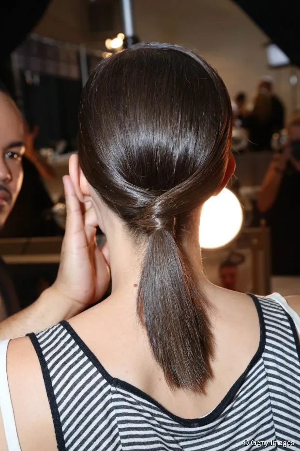 A woman in black and white lining top and Low Ponytail A woman in black and white lining top and Low Ponytail - Hairstyles for Girls with Medium Hair