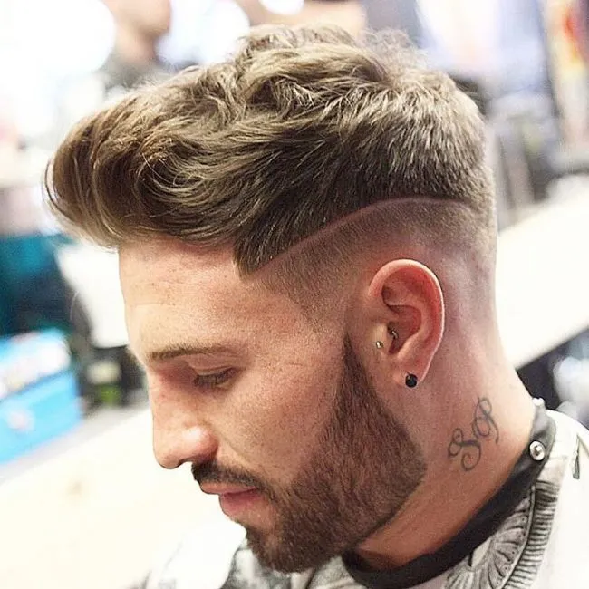 A man with a tattoo on his neck showing his Slick with Surgical Lines hairstyle A man with a tattoo on his neck showing his Slick with Surgical Lines hairstyle - short hairstyles for boys 2021