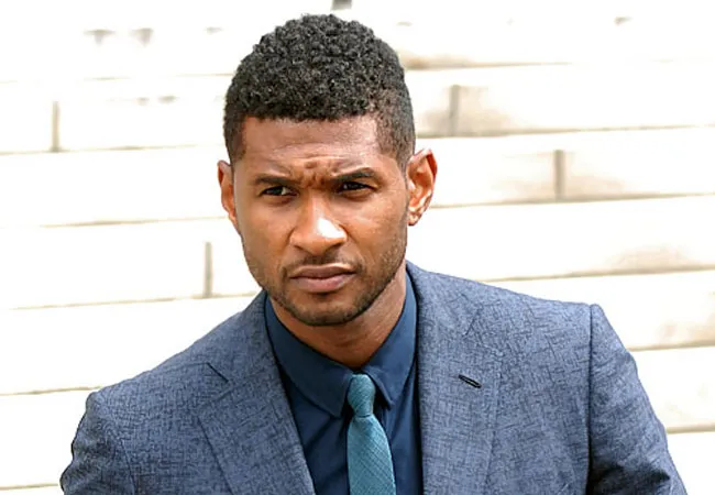 A man in blue suit with tie showing his Sponge Curls Hairstyle A man in blue suit with tie showing his Sponge Curls Hairstyle - latest haircuts for Men 2022