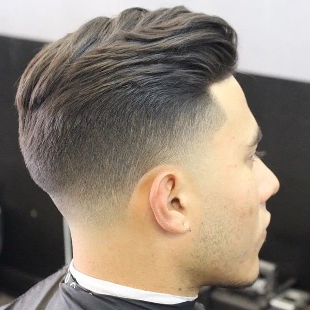 A man is showing the side view of his Taper Fade Hairstyle A man is showing the side view of his Taper Fade Hairstyle - haircuts for Men 2022