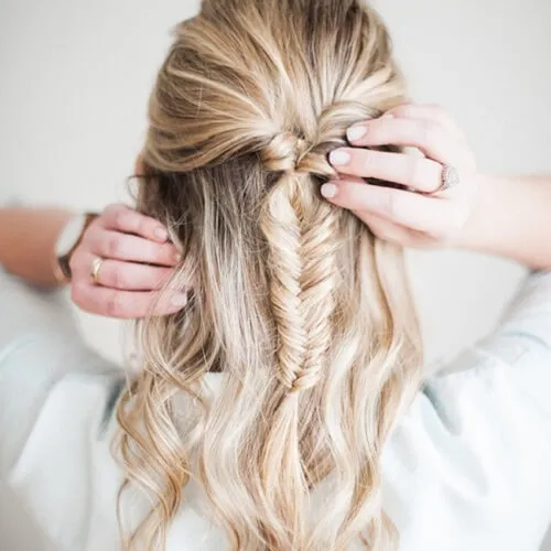 A woman in white shirt and pulled fish tail hairstyle A woman in white shirt and pulled fish tail hairstyle - hairstyles for girls with medium hair