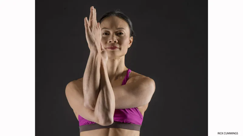 8 Yoga Poses to Strengthen Your Wrists and Prevent Injury 5 Activate rotator cuffs with eagle pose arms - Garudasana Arms
