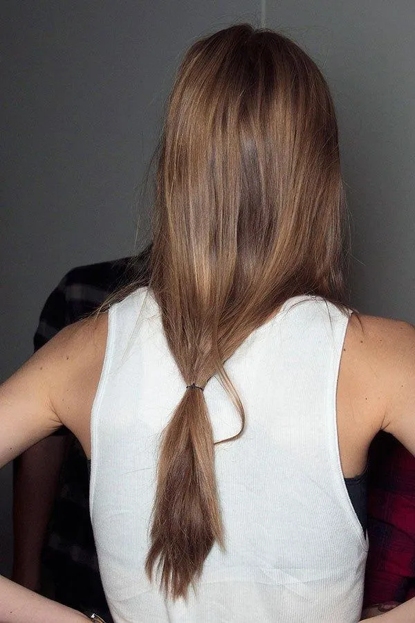 Woman in white cut sleeves top and Loose Ponytails Woman in white cut sleeves top and Loose Ponytails - hairstyle for long hair party