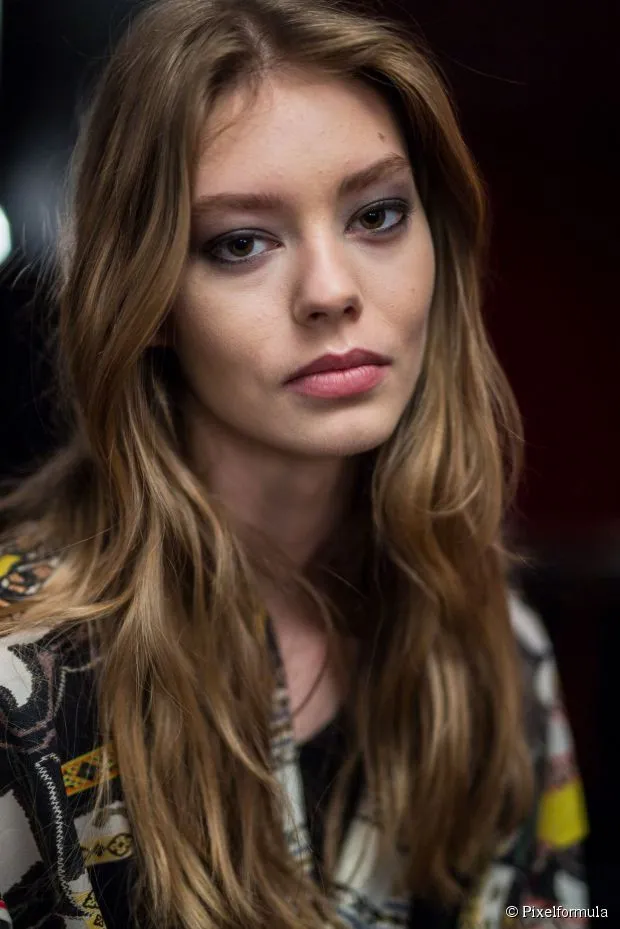 Woman in multi color shirt and Tousled Layer Long Hair Woman in multi color shirt and Tousled Layer Long Hair - hairstyle for long hair on jeans top