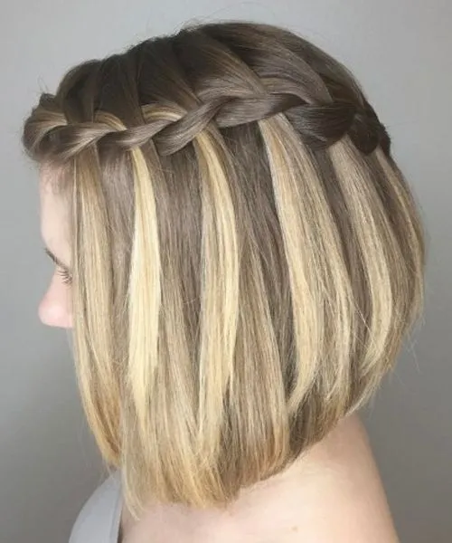 A girl in grey onw shoulder dress showing the side view of her A-line Lob with Braid A girl in grey onw shoulder dress showing the side view of her A-line Lob with Braid - Haircut Teenage Girls