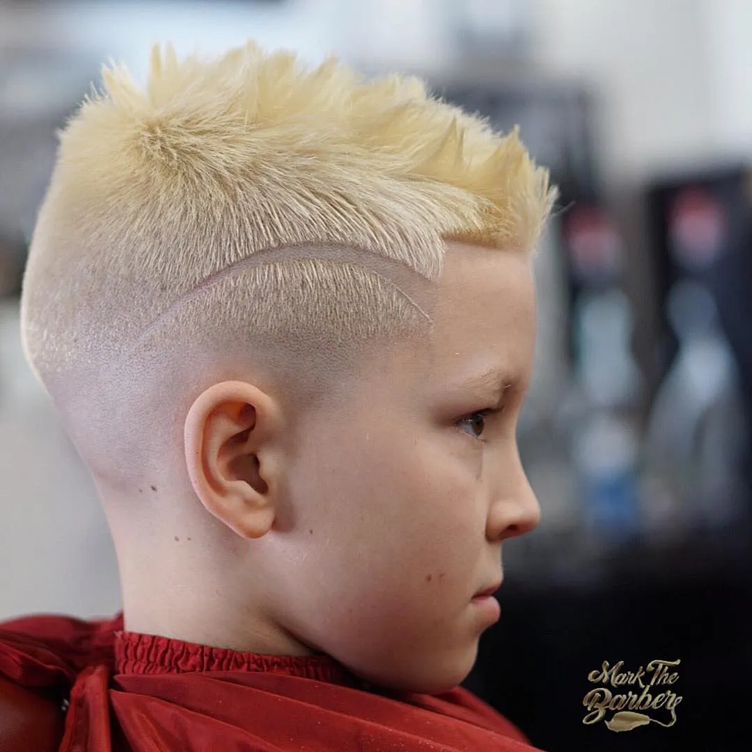 30 Short Latest Hairstyle for Men 2023 12 Blonde Burst Fade Mohawk with Design Short Hairstyle for Men