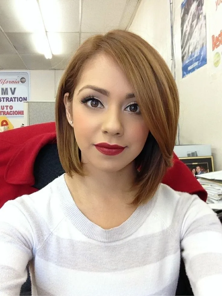 A girl in grey and white lining top with maroon lipstick showing her Short bob to long bob A girl in grey and white lining top with maroon lipstick showing her Short bob to long bob - latest haircuts for teenager girls