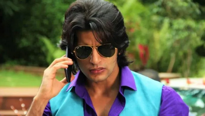 Karanvir Bohra in green and blue shirt taking over phone Karanvir Bohra in green and blue shirt taking over phone - Most Handsome Indian TV Actors