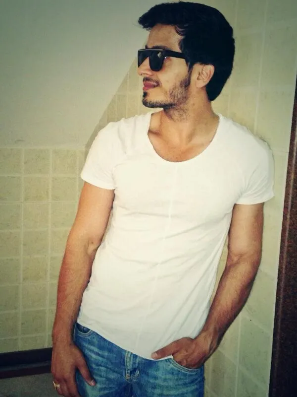 Param Singh in white t-shirt and blue denim with goggles Param Singh in white t-shirt and blue denim with goggles - Most Handsome Indian TV Actors