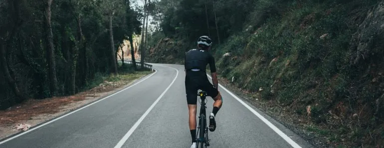 Male professional cyclist climbing in the Spanish mountains
