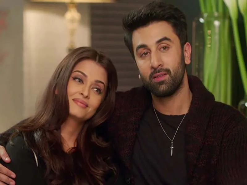 Ranbir in all back outfit posing with Aishwarya Rai Bacchan - Ranbir Kapoor Latest Hairstyles