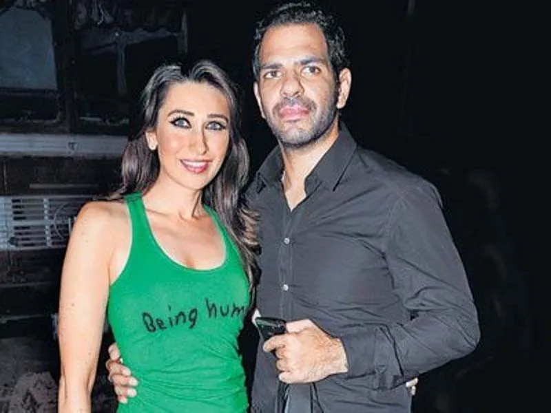 Karishma and Sunjay smiling and posing for camera Karishma and Sunjay smiling and posing for camera - famous bollywood divorces