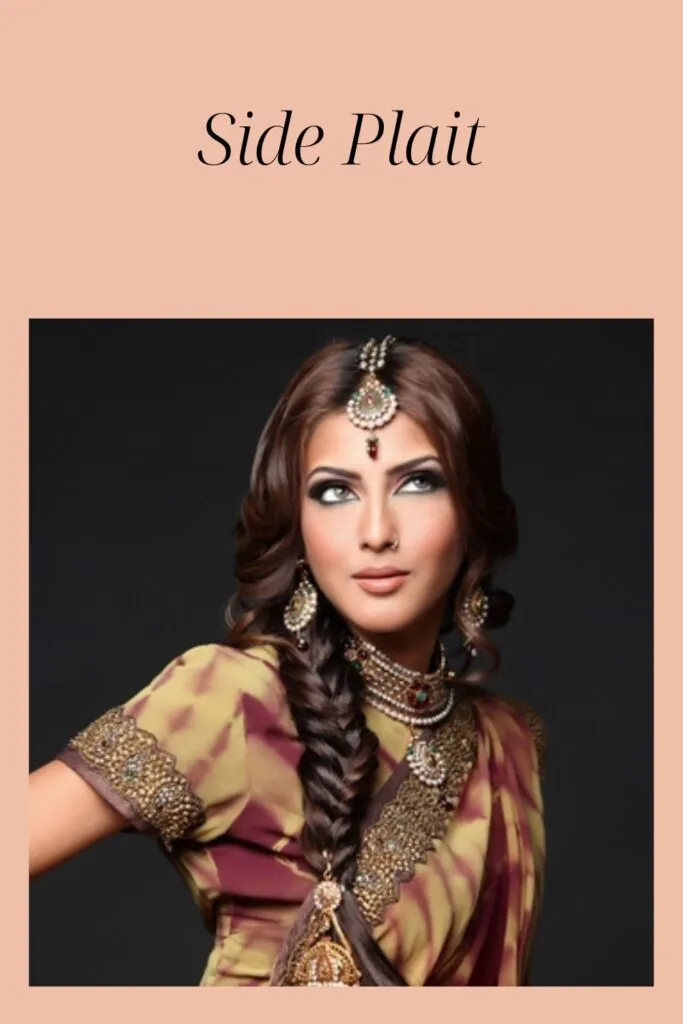 A women in multi color saree and matching jewellery showing her side plait hairstyle A women in multi color saree and matching jewellery showing her side plait hairstyle - Latest Indian hairstyles