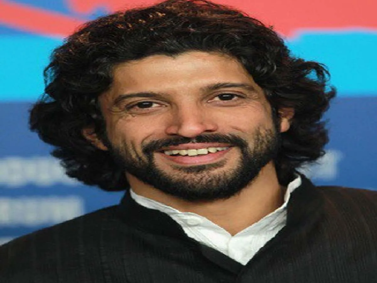 Farhan Akhtar in black coat with white shirt Farhan Akhtar in black coat with white shirt - Bollywood actors' hairstyle