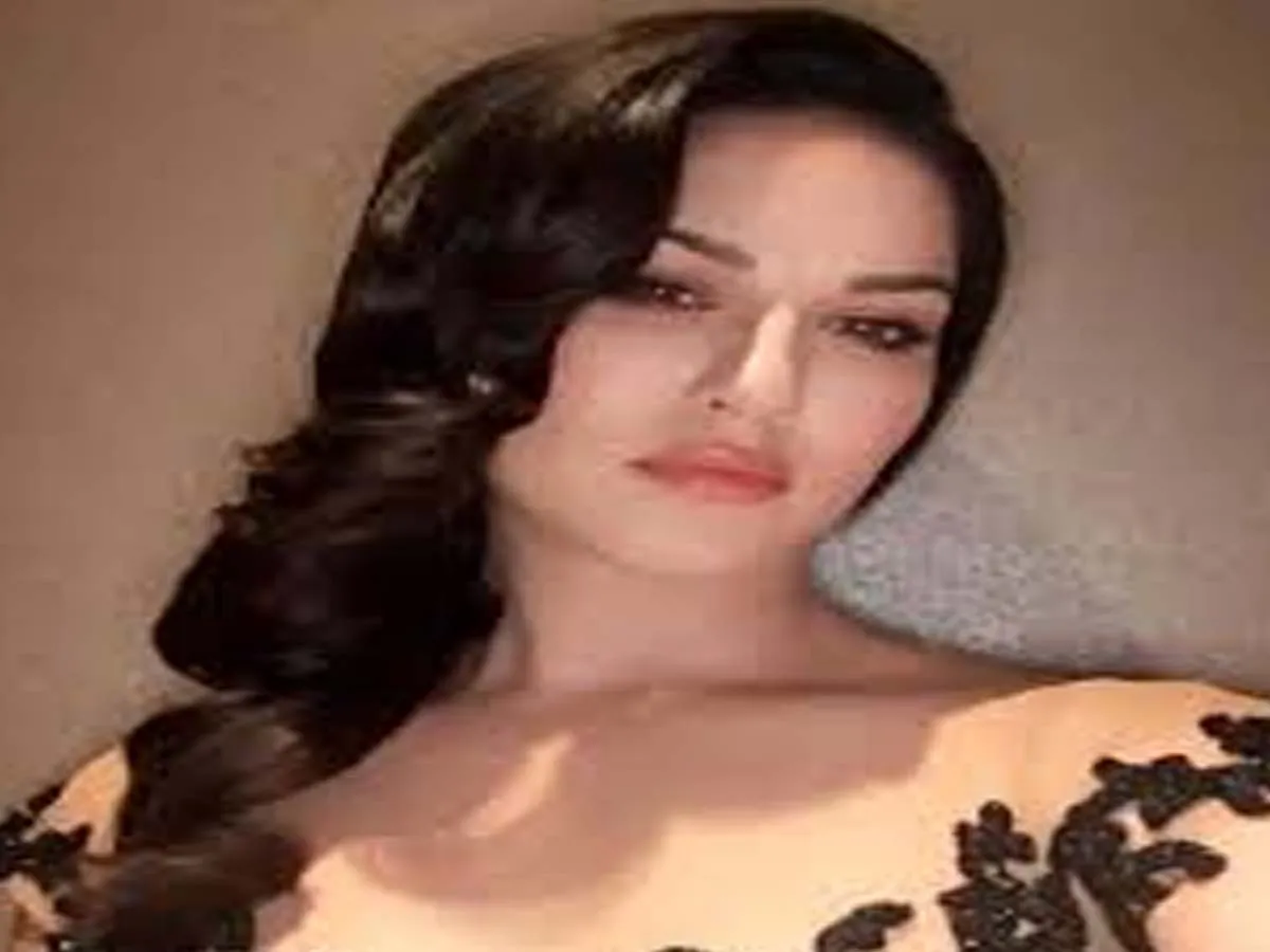 Sunny Leone in black off-shoulder dress and long curled open hair - Sunny Leone latest Hairstyles