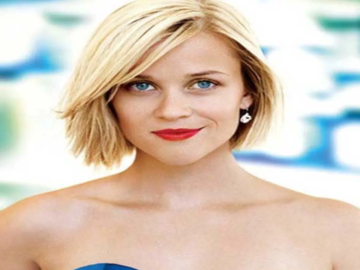 Reese Witherspoon in off shoulder dress with red lipstick posing for camera - hollywood actresses short hair